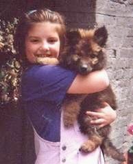 young girl holding Freya as a puppy